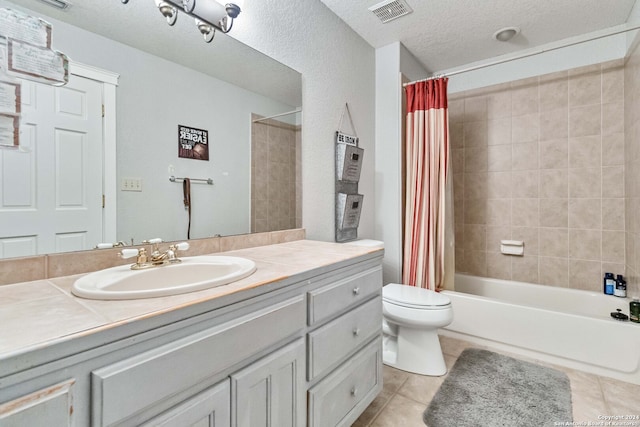 full bathroom with tile patterned flooring, toilet, shower / tub combo, vanity, and a textured ceiling