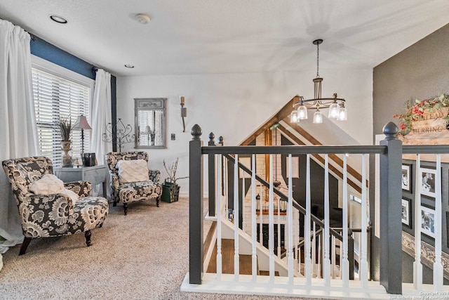 interior space featuring an inviting chandelier and carpet