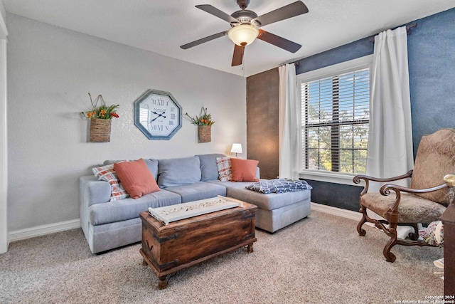 living room with ceiling fan and carpet floors