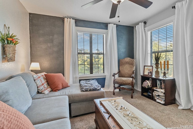 living room with ceiling fan and carpet flooring