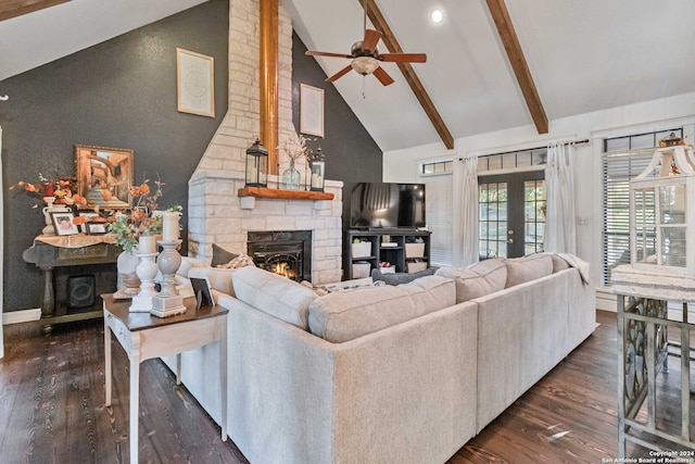 living room featuring beamed ceiling, high vaulted ceiling, ceiling fan, a stone fireplace, and dark hardwood / wood-style floors