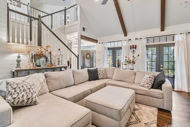 living room with dark wood-type flooring, ceiling fan, high vaulted ceiling, and french doors