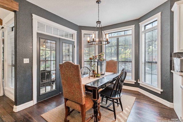 dining room featuring a chandelier and dark hardwood / wood-style floors