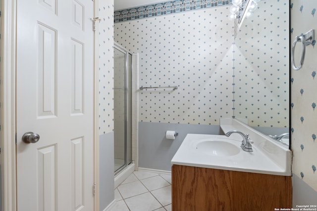 bathroom with vanity, tile patterned floors, and a shower with door