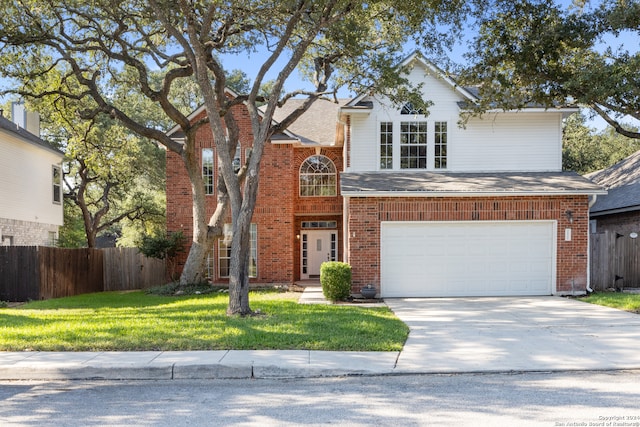 front facade featuring a garage and a front yard