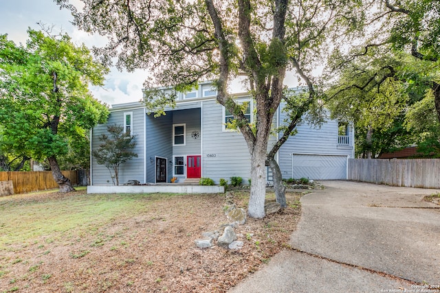 view of front of house with a garage and a front yard