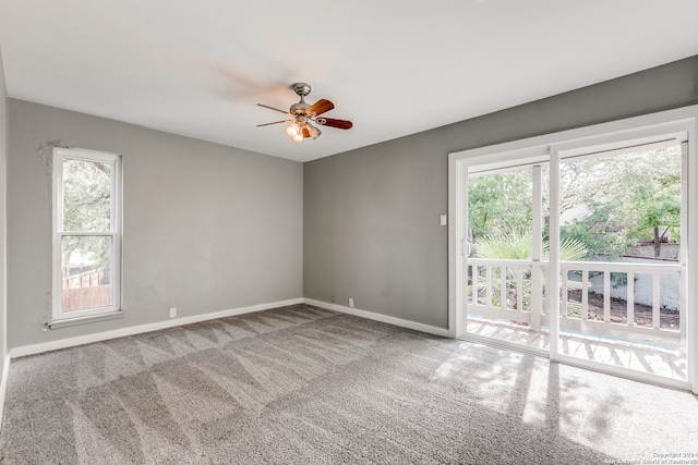 carpeted empty room with ceiling fan