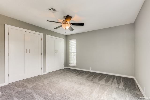 unfurnished bedroom featuring carpet flooring and ceiling fan