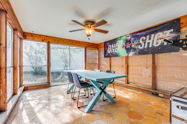 sunroom featuring ceiling fan