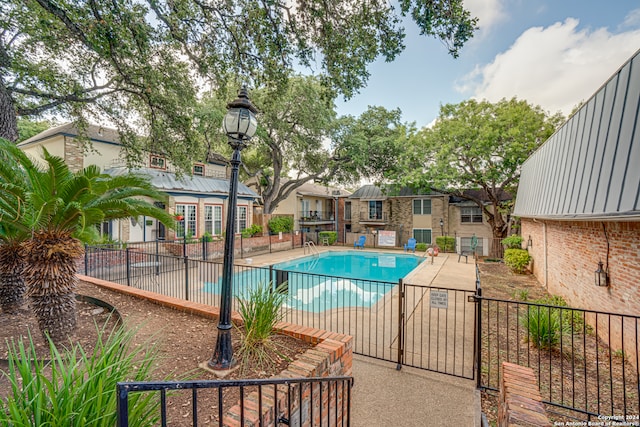 view of swimming pool with a patio