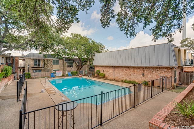 view of pool featuring a patio area