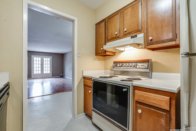 kitchen featuring light wood-type flooring and white appliances