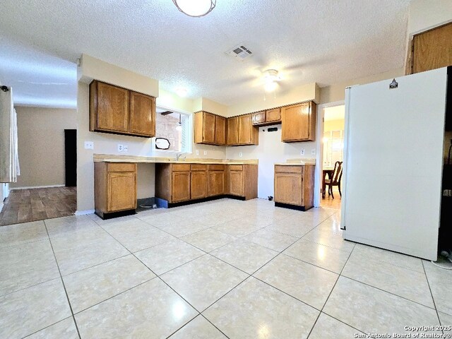 unfurnished bedroom with multiple windows, ceiling fan, and hardwood / wood-style floors