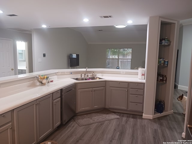 bathroom with crown molding, vanity, lofted ceiling, and hardwood / wood-style floors