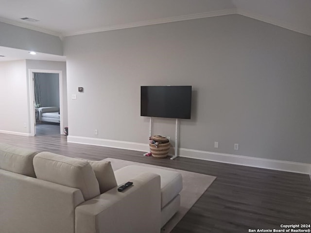 living room featuring ornamental molding, dark wood-type flooring, and lofted ceiling