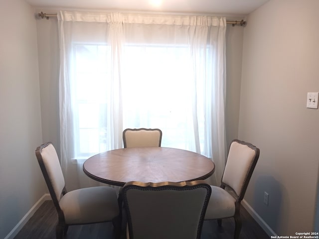 dining area with hardwood / wood-style flooring