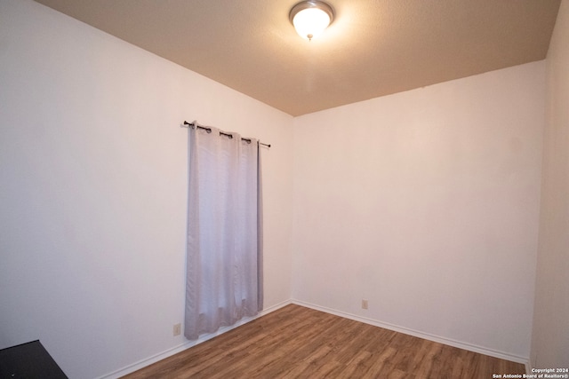 unfurnished room featuring wood-type flooring