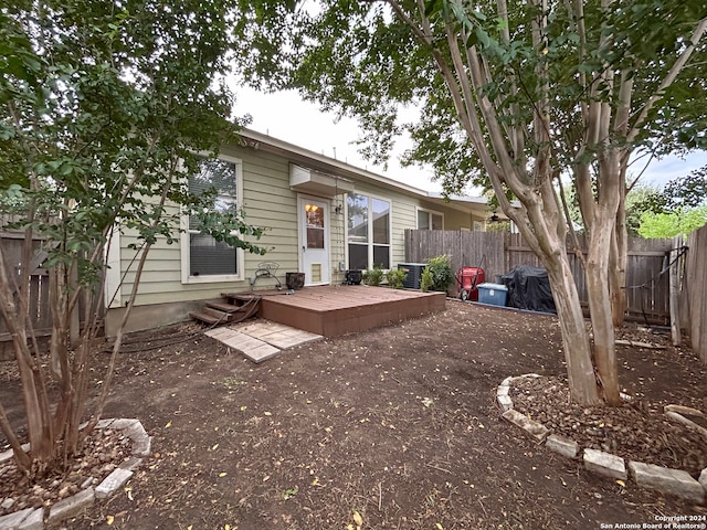 rear view of property with a deck