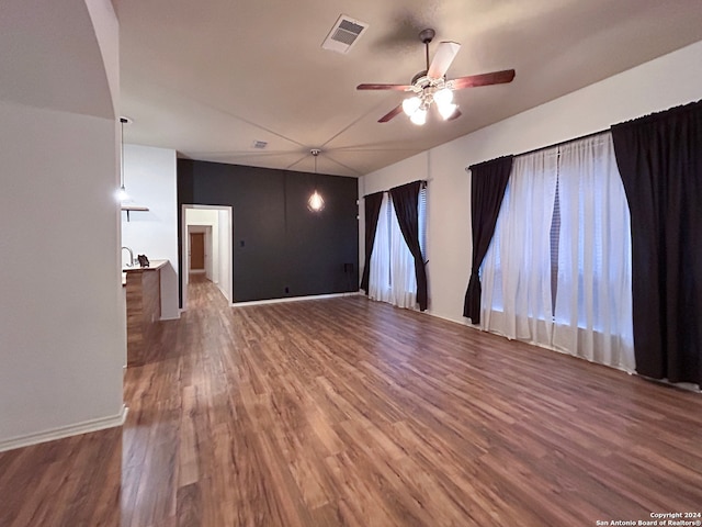 unfurnished room featuring ceiling fan and dark hardwood / wood-style floors