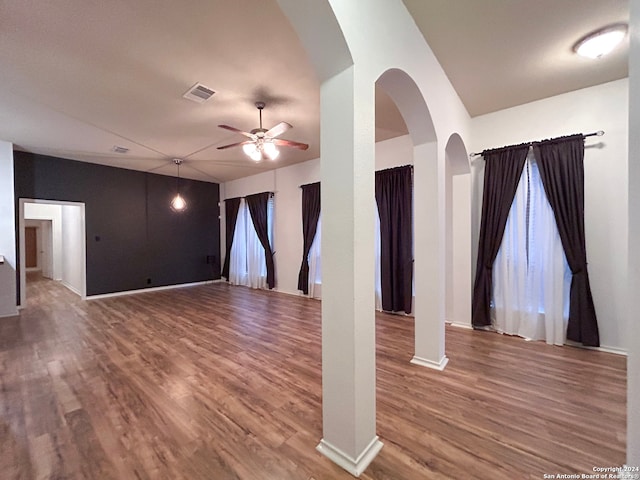 unfurnished room with ceiling fan and hardwood / wood-style floors