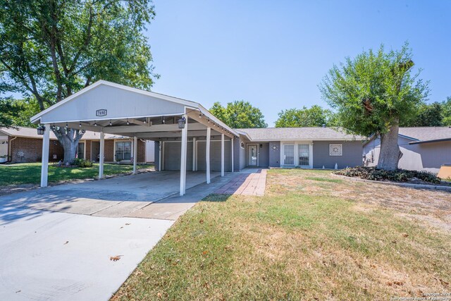 view of front facade featuring a garage and a front lawn