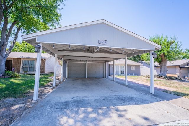 view of front facade featuring a garage and a carport