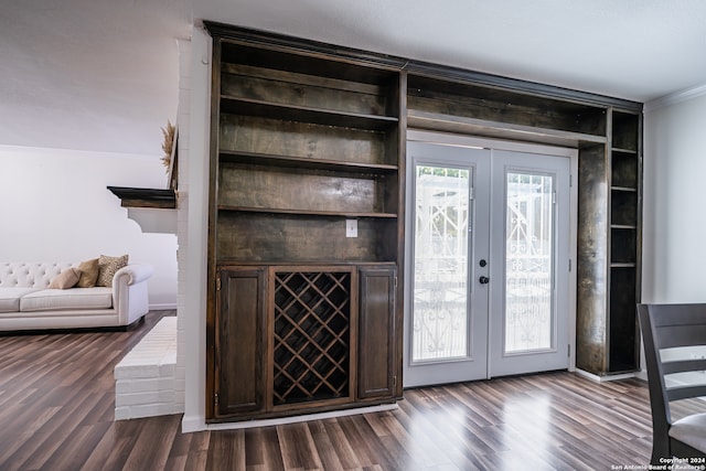 bar with crown molding, french doors, dark hardwood / wood-style flooring, and dark brown cabinets