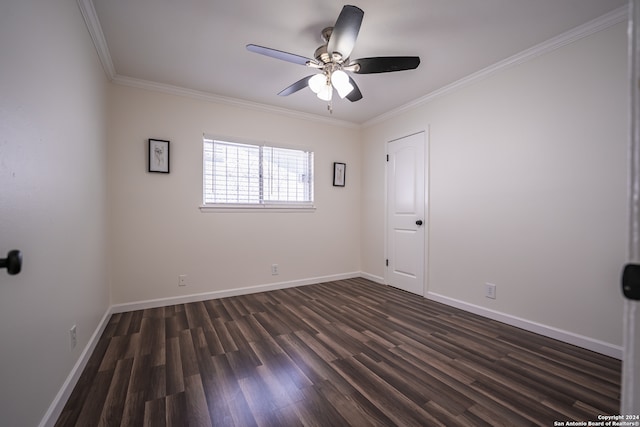 empty room with crown molding, dark wood-type flooring, and ceiling fan