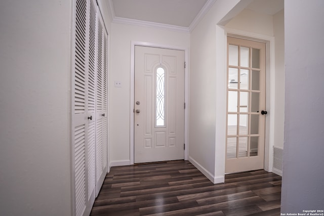 entryway with dark wood-type flooring and crown molding