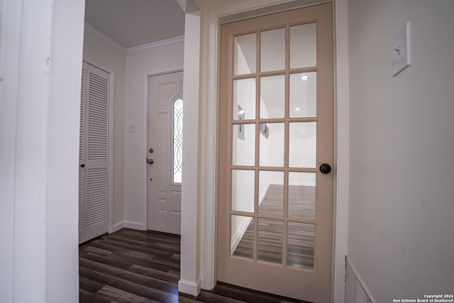 interior space with crown molding and dark wood-type flooring