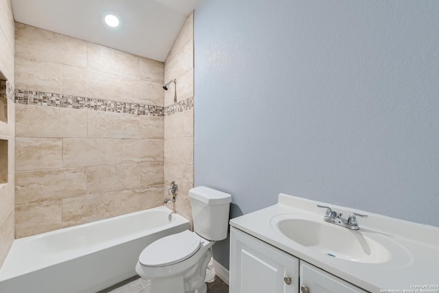 bathroom featuring shower / bathing tub combination, vanity, and toilet