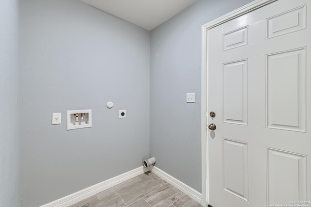 laundry room featuring hookup for a washing machine, gas dryer hookup, electric dryer hookup, laundry area, and baseboards