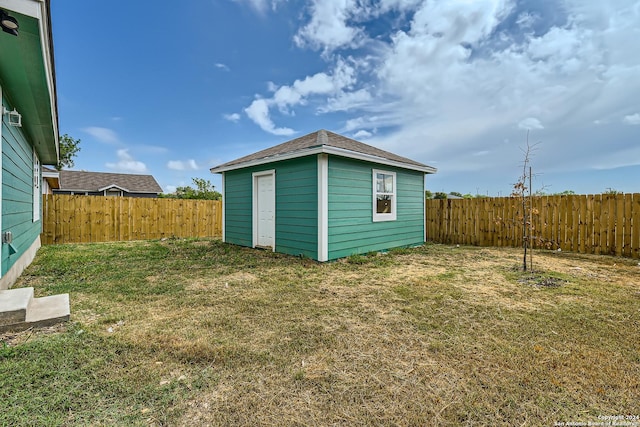 view of shed featuring a fenced backyard