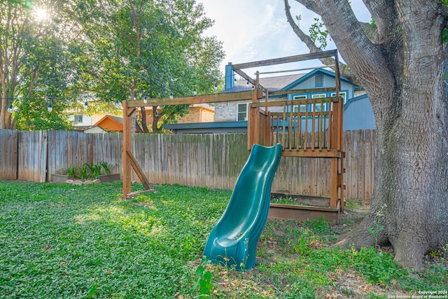 view of playground featuring a lawn