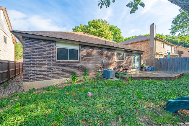 back of house with a yard, a patio area, and central AC unit