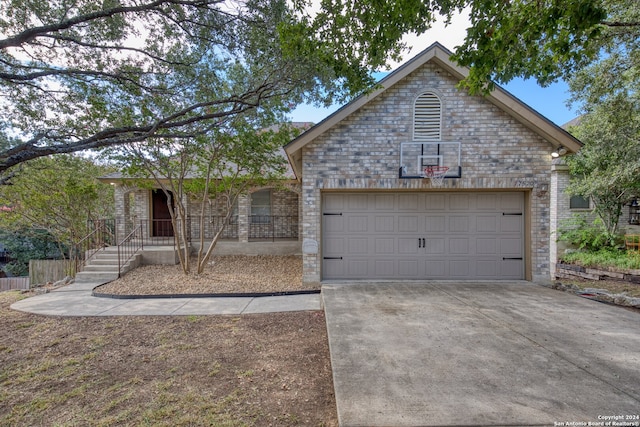 single story home featuring a garage and covered porch