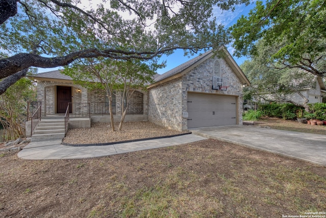 single story home featuring a garage