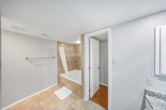 bathroom with tile patterned floors and vanity