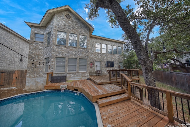 view of pool featuring a wooden deck