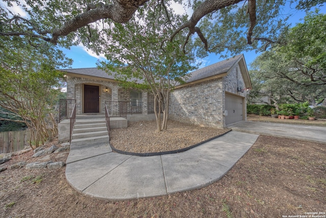 view of front of home featuring a garage and a porch