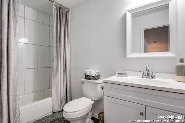 full bathroom with vanity, toilet, and shower / bath combination with curtain