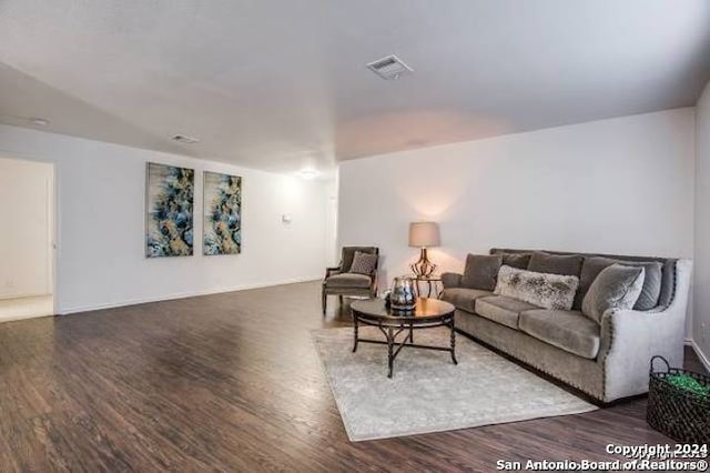 living room with dark hardwood / wood-style floors