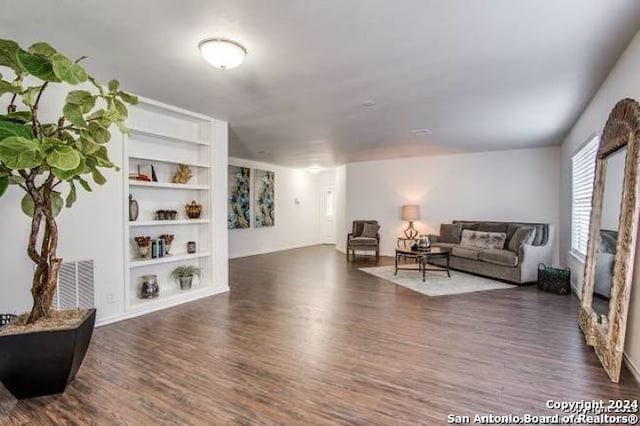 living room featuring dark wood-type flooring