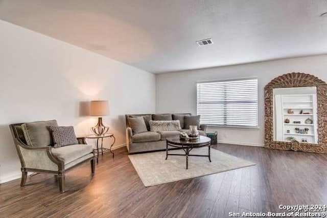 living room with dark wood-type flooring