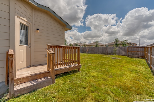 view of yard featuring a wooden deck