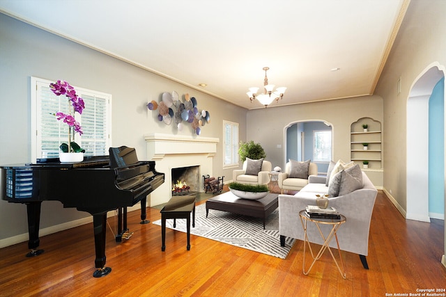 living room featuring a chandelier and hardwood / wood-style flooring