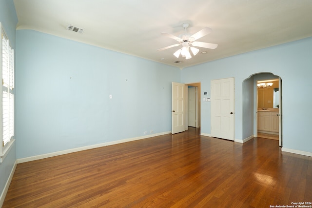 interior space with dark wood-type flooring and ceiling fan