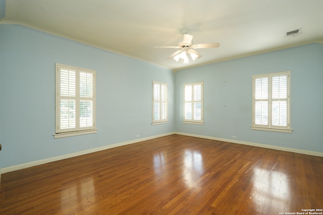 unfurnished room featuring ceiling fan and dark hardwood / wood-style floors