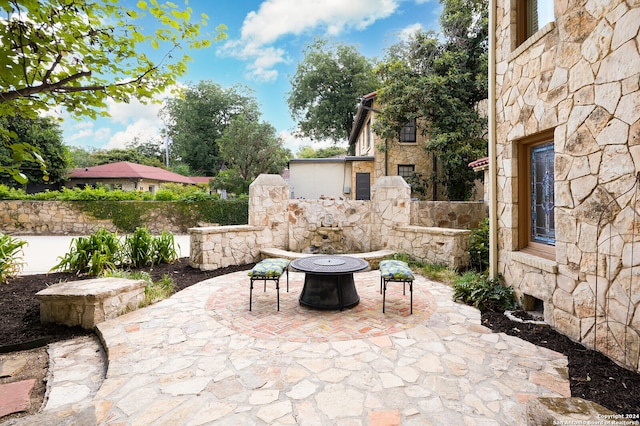 view of patio featuring a fire pit