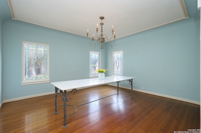 unfurnished office with ornamental molding, dark wood-type flooring, and a chandelier